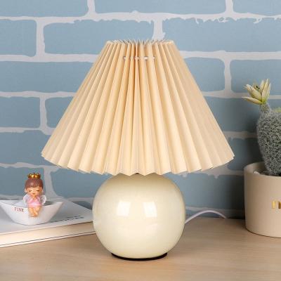 China Modern Cheap Price Hotel E27 LED Home Decoration Bedside Ceramic Fabric Table Lamp for sale