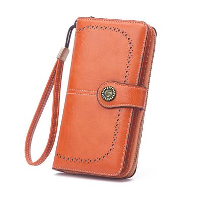 China Long Card Wallet Vintage Leather Waterproof Ladies Oil Wax Hollow Wallet Women's Clutches Purse for sale