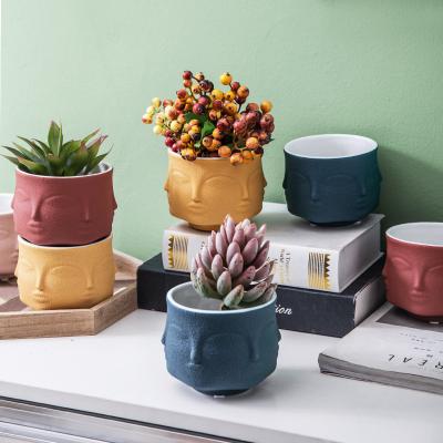 China Nordic Home Matte Delicate Small Ceramic Flower Vase Human Face Flower Vase Decoration Ceramic Artifact Vases Home Decor Pots and Planters for sale