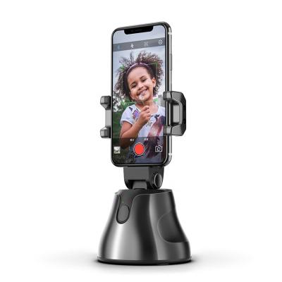 China 2020 Hot Selling AI Authomatic Genie Portable Smart Shooting 360 Rotation Auto Face Adjustable Object Tracking Cell Phone Holder for sale