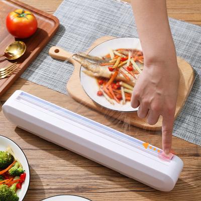 China Manual Slide Moisture Proof Plastic Wrap Cutter Film Wrap Food Tool Kitchen Storage Cutter Dispenser for sale