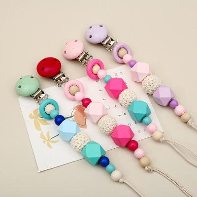 China 2021 BPA Free Soother Pacifier Clip Beach Crabs Teething Silicone Baby Pacifier Clips Wood Holder for sale