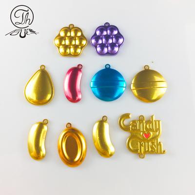 China Shiny Gold Bean Shape Key Chain Aluminum Pendant Decoration Candy Crush Charm for sale