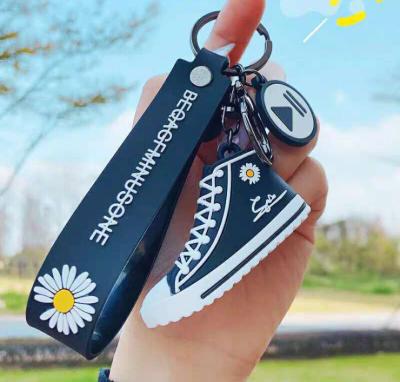 China Small Daisy PVC Durable Shoe Key Chain 3D Korean Key Chain Shoe Shape Rubber Key Ring for sale