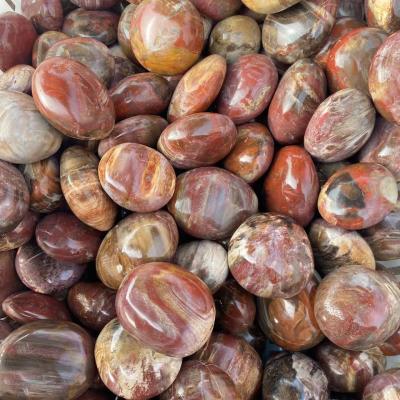 China Wholesale natural crystal woodstone folk art quartz palm polishing wood fossil natural stone for decoration for sale