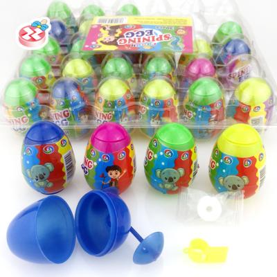 China Cartoon Toys New Surprise Plastic Egg Candy Toy Surprise Spinning Egg Candy for sale