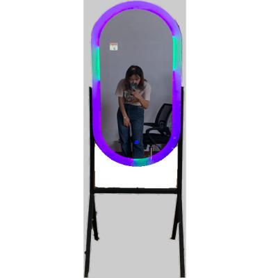 China Cheap Dropshipping Smart Oval Photo Booth Floor Standing Mirror Photo Booth 2022 Touch Monitor Selfie Mirror Magic Photobooth Led Light Vending Machine for sale