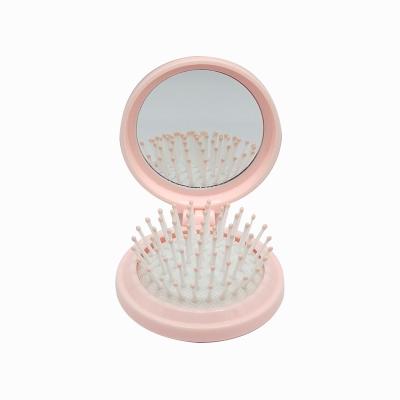 China Wholesale Portable Travel Comb Flower Cushion Comb With Cute Folding Makeup Mirror Comb For Women for sale