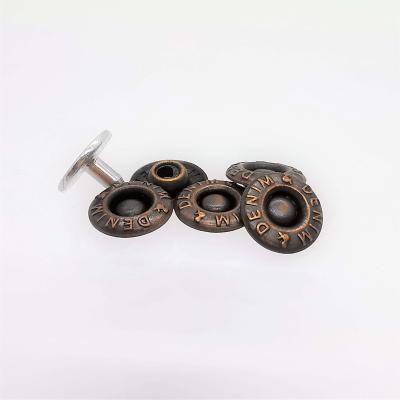 China Viable Exquisite and Beautiful Brass Nipple Down Rivet Embossed Logo Buttons Lattice Label Button for sale