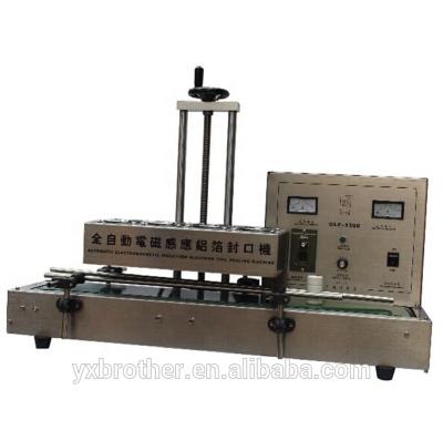 China Automatic Food Electromagnetic Induction Aluminum Foil Sealing Machine for sale