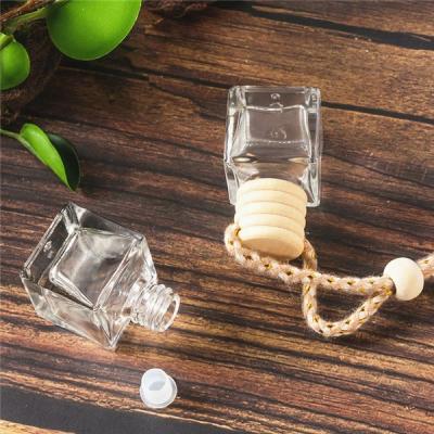 China Personal Care Custom Hanging Perfume Car Air Freshener Bottles 10ml Wooden Lid Square Empty Aroma Glass Car Perfume Diffuser Bottle for sale