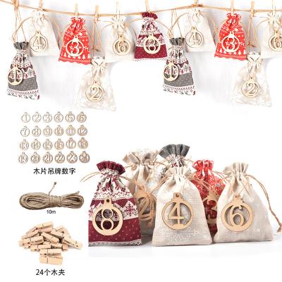 China Cloth 2020 Amazon best selling 24pcs candy gift bags drawstring Christmas Gift pouch christmas gift bag sets with figure tags for sale