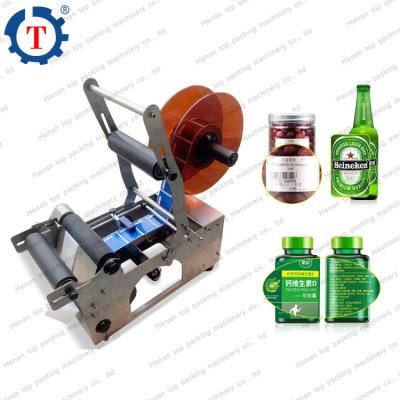 China Plastic Bottle Adhesive Sticker Glass Food Manual Bottle Labeling Machine for sale