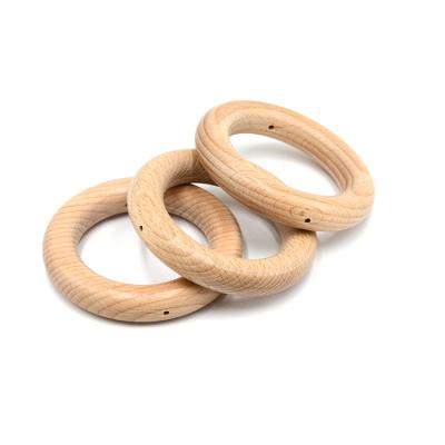 China New Design Eco Friendly Beech 2 Hole Baby Wooden Teether for sale