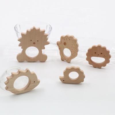 China Eco-Friendly Baby Toy Wooden Hedgehog Shape Baby Teething Wood Toys Teether for sale