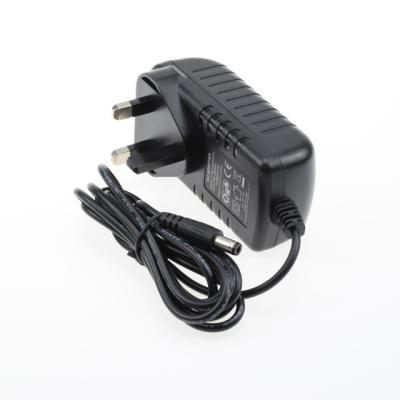 China ac to dc 3 pin 12v 24w uk wall plug ac dc power changeover 2a adapter for sale