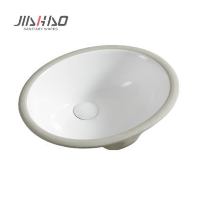 China Modern Jiahao China Made Glossy Sink Oval Shape Ceramic Basin Under Counter Wash Basin for sale