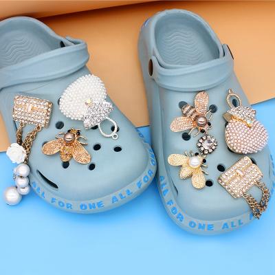 China Shoe buckle summer made in china best selling pearl designer high quality bling charms with chain charms for crocs for sale