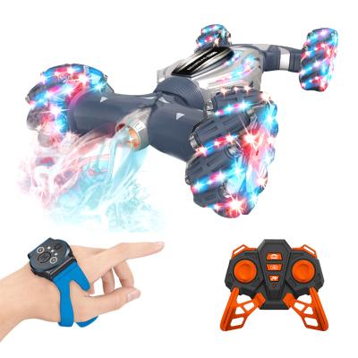 China 2.4G Cartoon Toy Stunt RC Toy Car 360 Rotation Spinning Mist Spray Double Side Twisting Stunt Car 360 Remote Control And Hand Gesture Control for sale