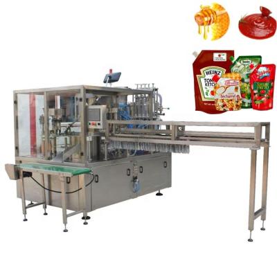 China Intermittent Rotary Premade Drink T Spouted Pouch Filling Capping Machine for sale