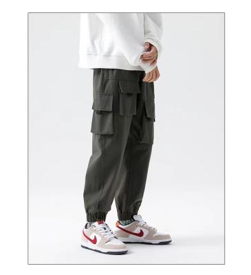 China 2022 New Men's Anti-Wrinkle 2022 Cargo Pant Work Pocket New Trend Heavy Duty Cargo Big Pants Loose Casual Pants Men's Outer Pocket for sale