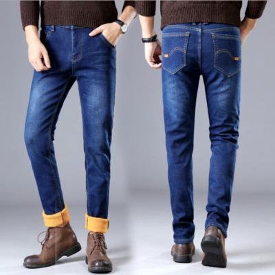 China Autumn and winter men's breathable jeans with pile thickened spring elastic straight warm waistband youth fashionable pants. for sale