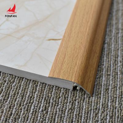 China Modern Aluminum Transition Trim Door Reducer Profile Wood Effect Floor Cover Ramp Floor Pad Tile Trim for sale