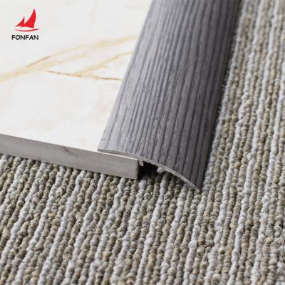 China Modern Professional Wood Texture Transition Trim Covering Aluminum Metal Partition Profile Strips For Floor Tiles Supplier for sale