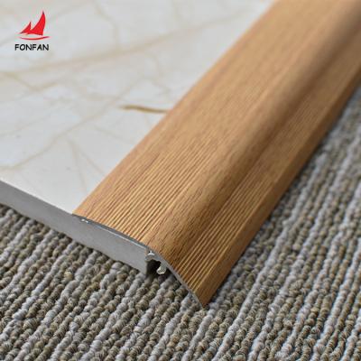 China Modern Warm Stripe Style Transition Railing Aluminum Profile Tarpaulin Decorative Floor Pad Tile Trim for sale