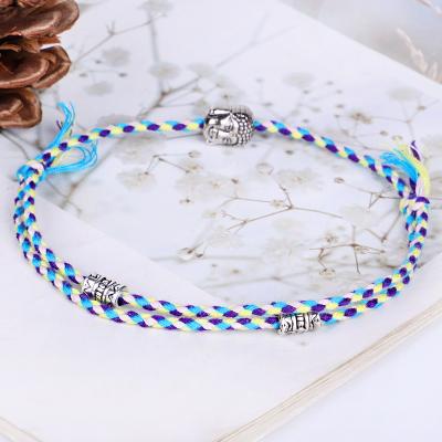 China FASHIONABLE Hot Selling Tibetan Buddha Head Accessories Hand Woven Cotton Rubbing Yarn Bracelet Adjustable Size for sale