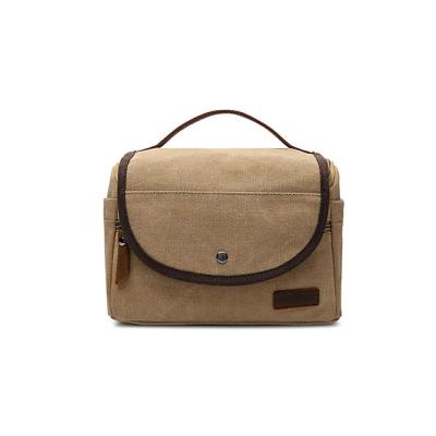 China Portable Vintage Toiletry Bag Dopp Kit Khaki Cotton Canvas Wash Toiletry Bag With Leather Badge for sale