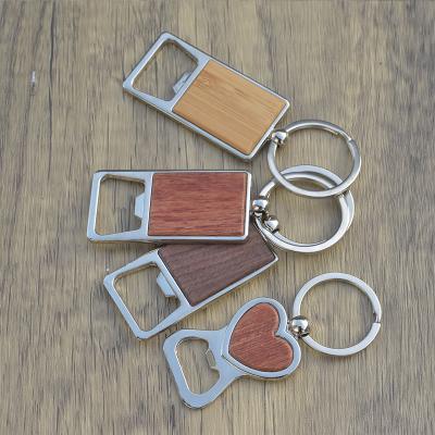 China Unique Professional Wooden Key Chain Bottle Opener Wooden Key Ring For Gift for sale