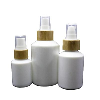 China Unique Shaped Cylinder 100ml Pure White Skin Care Cream Glass Cosmetic Lotion Packaging Bottles With Special Lid WP-031R for sale