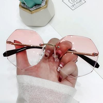 China Wholesale Custom Eyewear Trade Logo For Sunglasses Trend Rimless Sunglasses For Women for sale