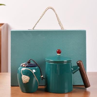 China Sustainable Ceramic Tea Cup With Lid Infuser And Tea Mugs Wooden Handle Gift Box Set Logo for sale