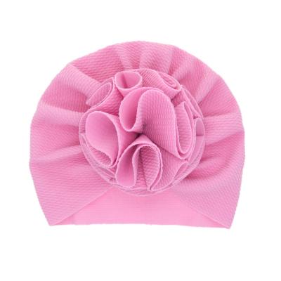 China Eco-Friendly Solid Color Comfortable Baby Sweater Hat Large Flower Tire Newborn Hats for sale