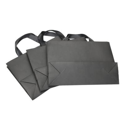 China Low MOQ Recyclable Matte Black Card Paper Black Custom Gift Bag, Gift Wrapping Paper Bag With Ribbon Handle for sale