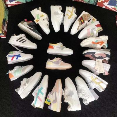 China New Children's Sneakers Microfiber Sneakers Genuine Leather Boys Girls Shoes White Shoes Damping for sale