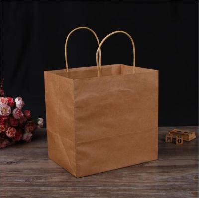 China Recycled Materials Wholesale Custom Logo Printing Cheap Brown Kraft Paper Bag With Handle for sale