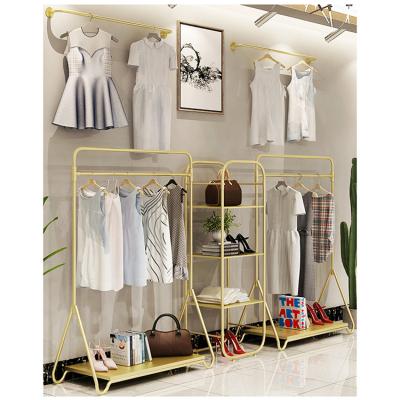 China Fashion Display Gold Metal Stainless Steel Shop Clothes Baby Store Clothing Garment Display Rack for sale