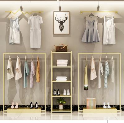 China New Design China Fashion Display Gold Style Retail Custom Wall Metal Rack Bedroom Clothing Display Rack Cabinet for sale