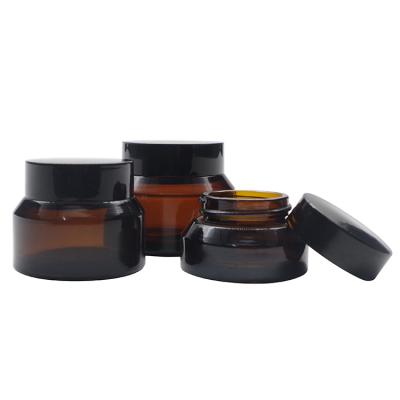 China Brown 15g 30g 50g Custom Luxury Bulk Oblique Shoulder Glass Cosmetic Cream Jars With Lids for sale