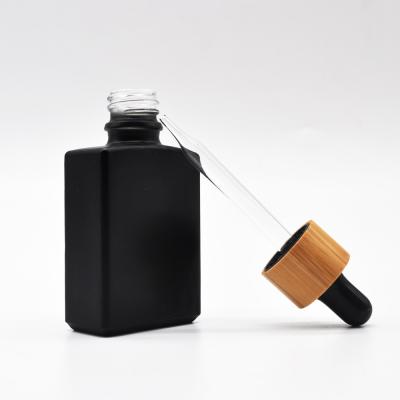 China Wholesale 30ml 60ml Square Matte Black Essential Oil Glass Cosmetic Bottle With Serum Droppers for sale