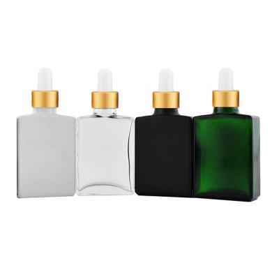 China Competitive Price 1oz 30ml Cosmetic Clear Amber Black Square Essential Oil Glass Dropper Bottles With Gold Lid for sale