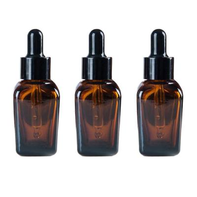 China 1oz Cosmetic Custom Container Amber Glass Essential Oil Bottles With Serum Pipette Black Eye Dropper for sale