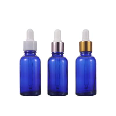 China Reasonable Price Cosmetic Unique 30ml 1 Ounce Cobalt Blue Dropper Cosmetic Packaging Glass Bottles for sale