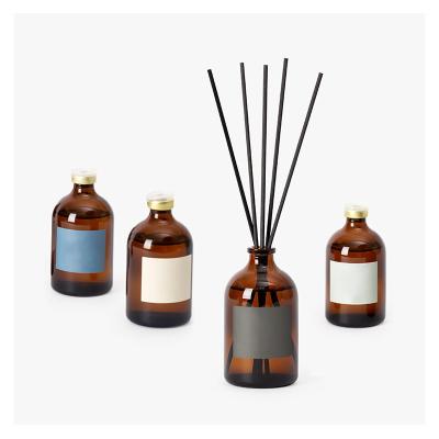 China Custom 50ml Empty Amber Color Cylinder Essential Oils Luxury Reed Diffuser Glass Aromatherapy Bottle With Cap for sale