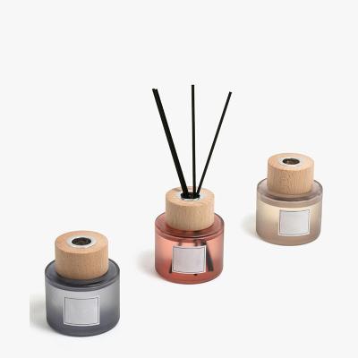 China High End Nordic Style Fireproof Frosted Cylinder Aromatherapy 100ml Reed Diffuser Bottle Glass With Wooden Caps for sale