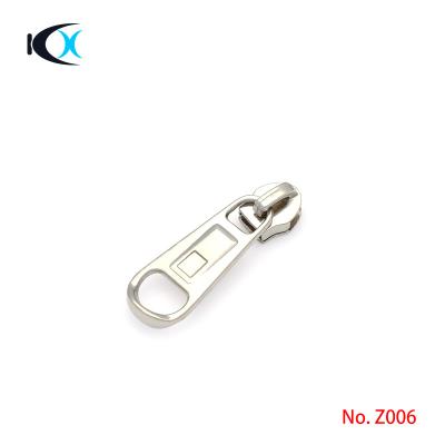 China Eco - Friendly Metal Accessories Bag Accessories Metal Zipper Puller Custom Zipper Head For Clothing for sale