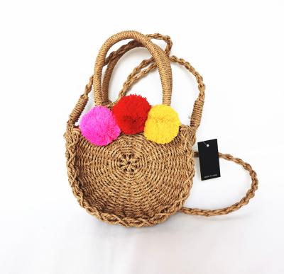 China Cute kids round paper straw bag with pom pom for sale